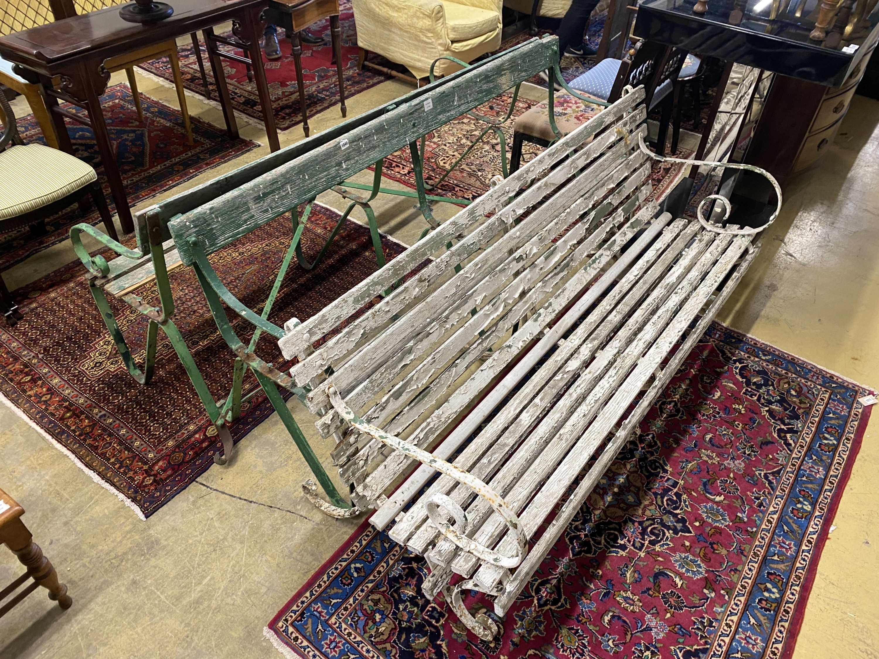 Three various painted wrought iron slatted wood garden benches, two in need of restoration, largest length 176cm, depth 70cm, height 78cm